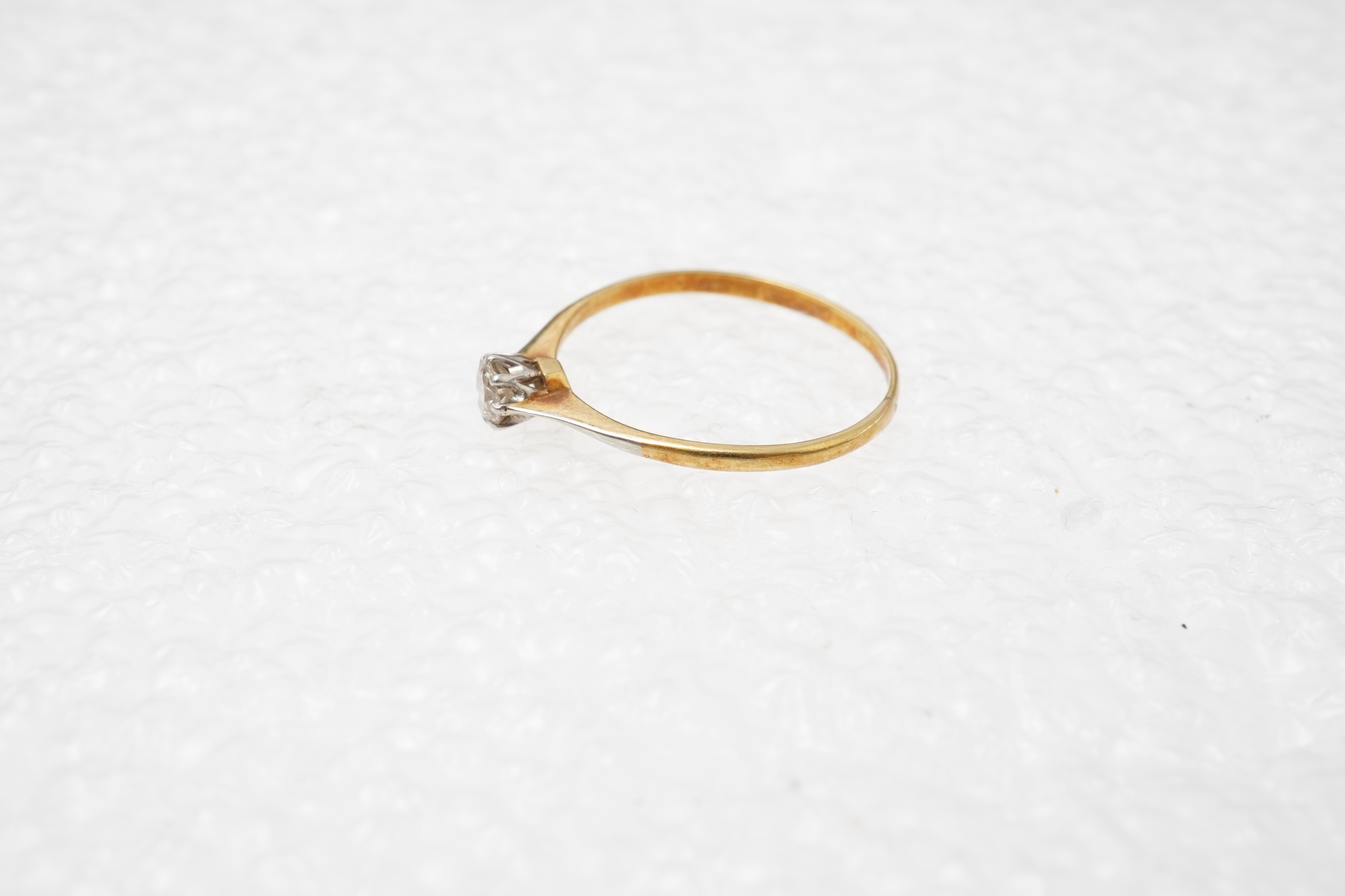 A small solitaire diamond ring, early 20th century